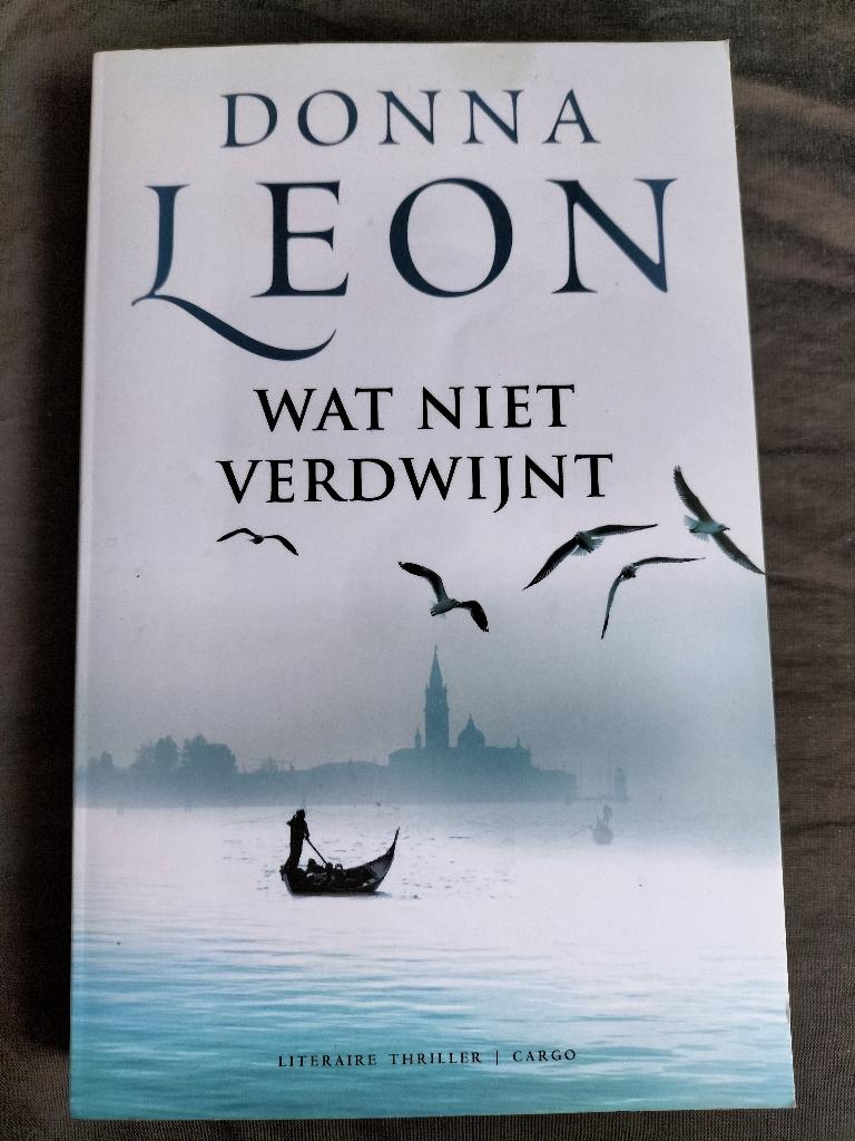 Donna Leon - Wat niet verdwijnt, Boeken, Thrillers, Zo goed als nieuw, Ophalen of Verzenden