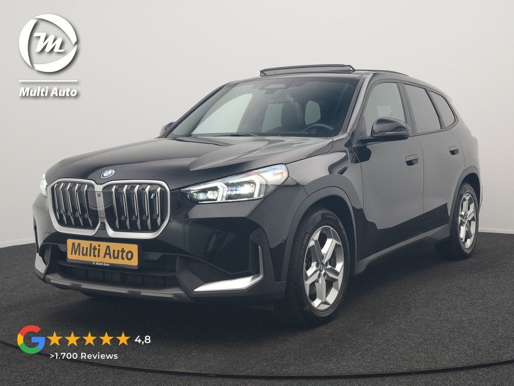 BMW iX1 xDrive30 67 kWh 313pk Dealer O.H. | Trekhaak Af Fabr, Auto's, BMW, Automaat, Gebruikt, Zwart, Zwart
