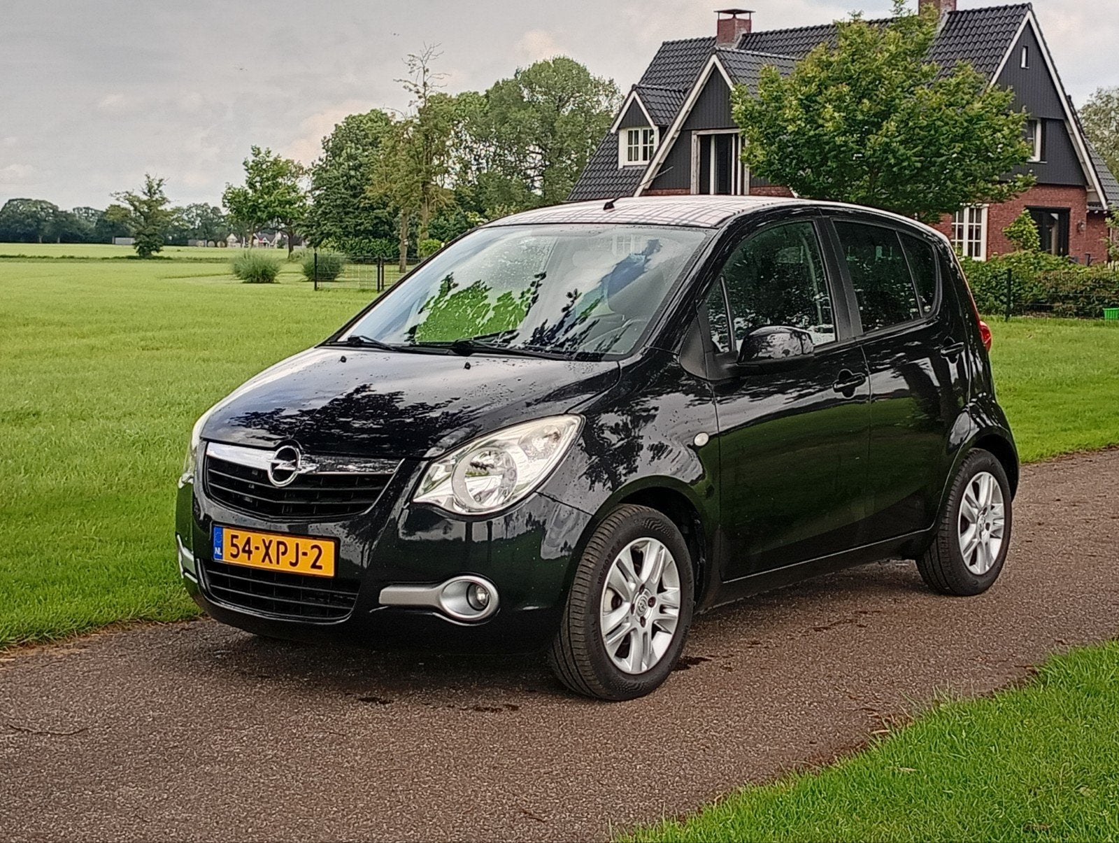 Opel Agila 1.0 12V 2012 Zwart Lm velgen, Stof, 31 €/maand, Origineel Nederlands, Bedrijf