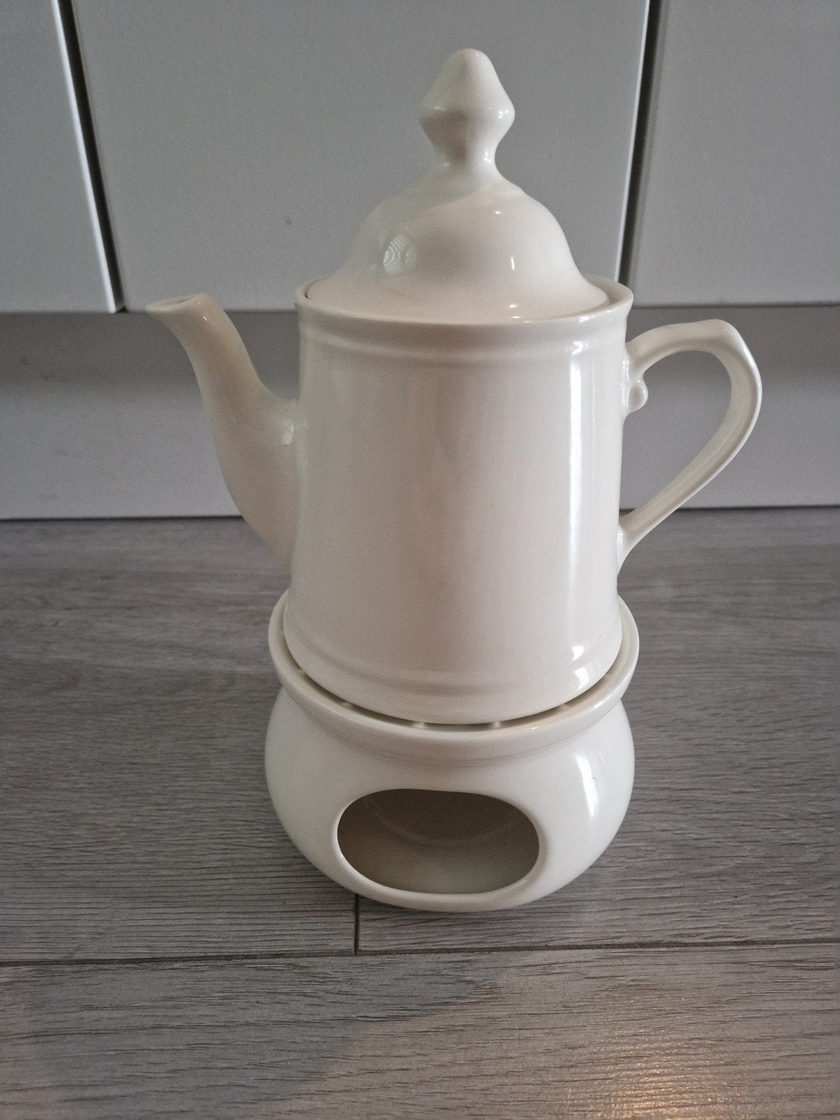 Theepot met theelichtje, Ophalen