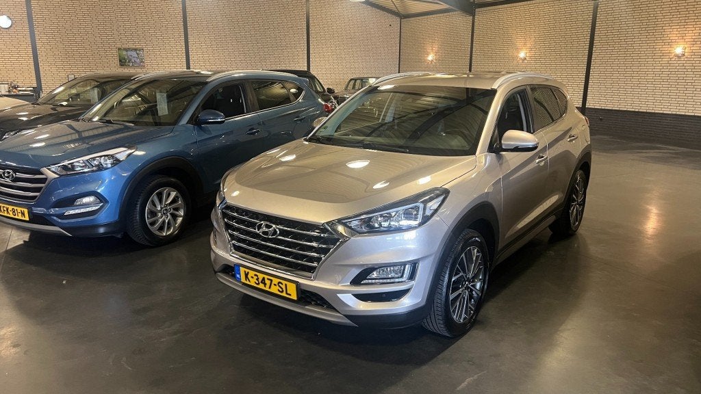 Hyundai TUCSON 1.6 T-GDI PREMIUM AUTOMAAT, Auto's, Hyundai, Gebruikt, 4 cilinders, Met garantie (alle), Beige