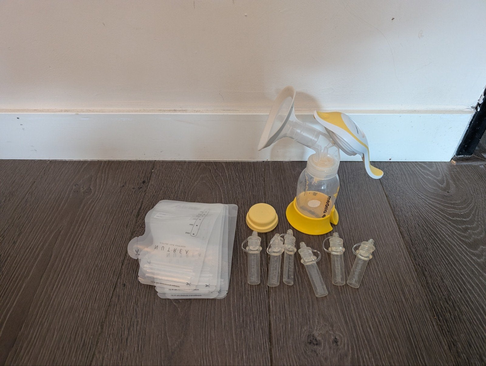 Medela handkolf met extra's, Ophalen of Verzenden, Zo goed als nieuw, Borstkolf