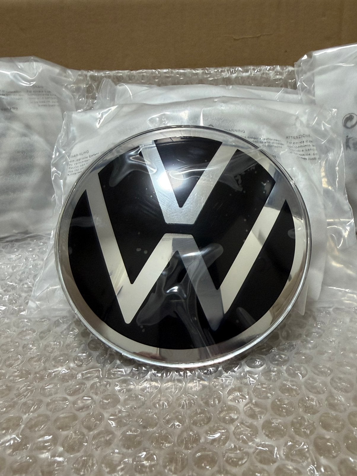 Vw Taigo Polo T-Roc Grille Vw Logo 5H0853601H Vw Grill logo✅, Auto-onderdelen, Ophalen of Verzenden, Nieuw, Volkswagen