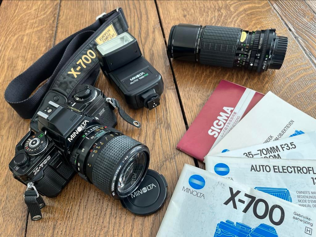 Minolta X-700 Spiegelreflexcamera met 2 lenzen en flitser, Audio, Tv en Foto, Fotocamera's Analoog, Ophalen of Verzenden, Gebruikt