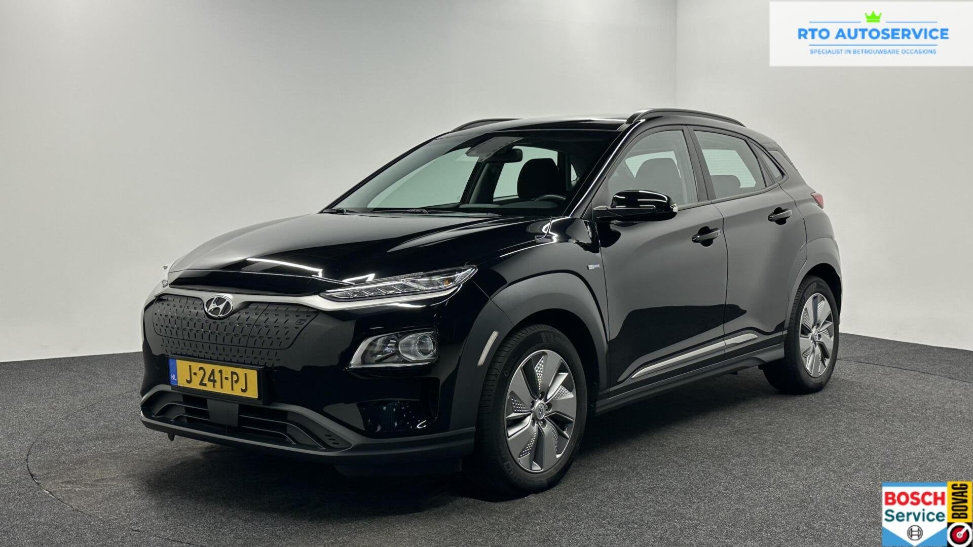 Hyundai Kona EV Comfort 64 kWh 3 Fase 100% SOH Warmtepomp CA, Auto's, Hyundai, Stof, Gebruikt, Met garantie (alle), Zwart