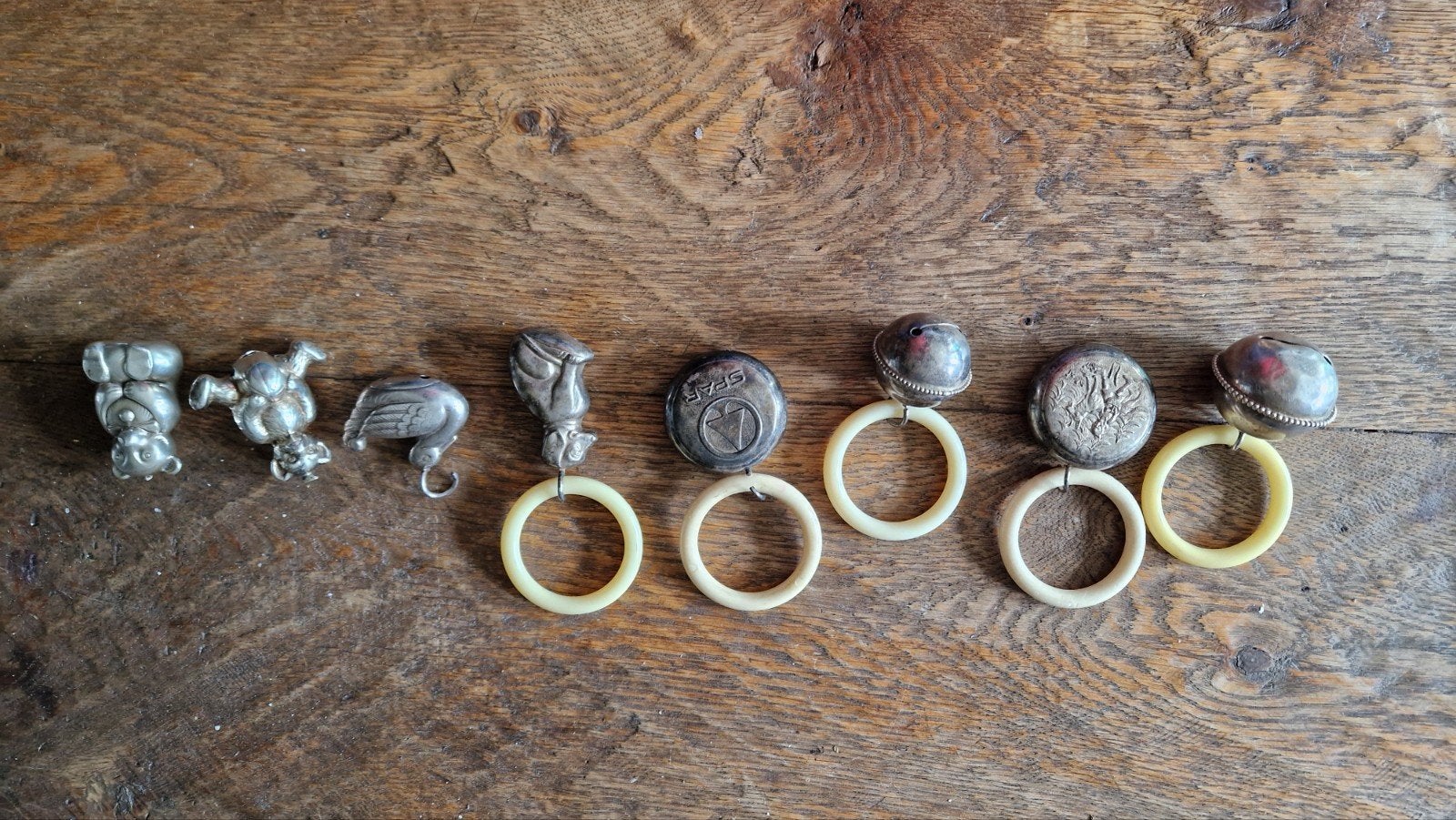 8 verzilverde bijtringen/rammelaars met dierenfiguren, Ophalen of Verzenden