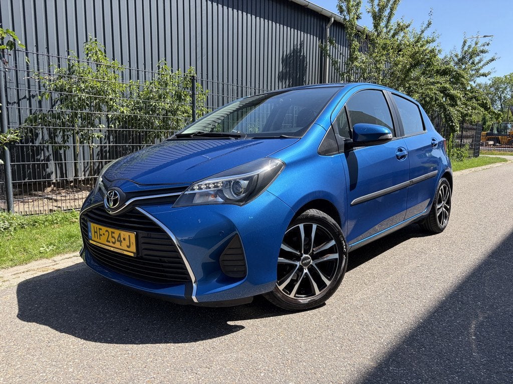 Toyota Yaris 1.0 VVT-i Aspiration / NAVI / CRUISE / CLIMATE, Auto's, Toyota, Voorwielaandrijving, 527 kg, Euro 6, Blauw
