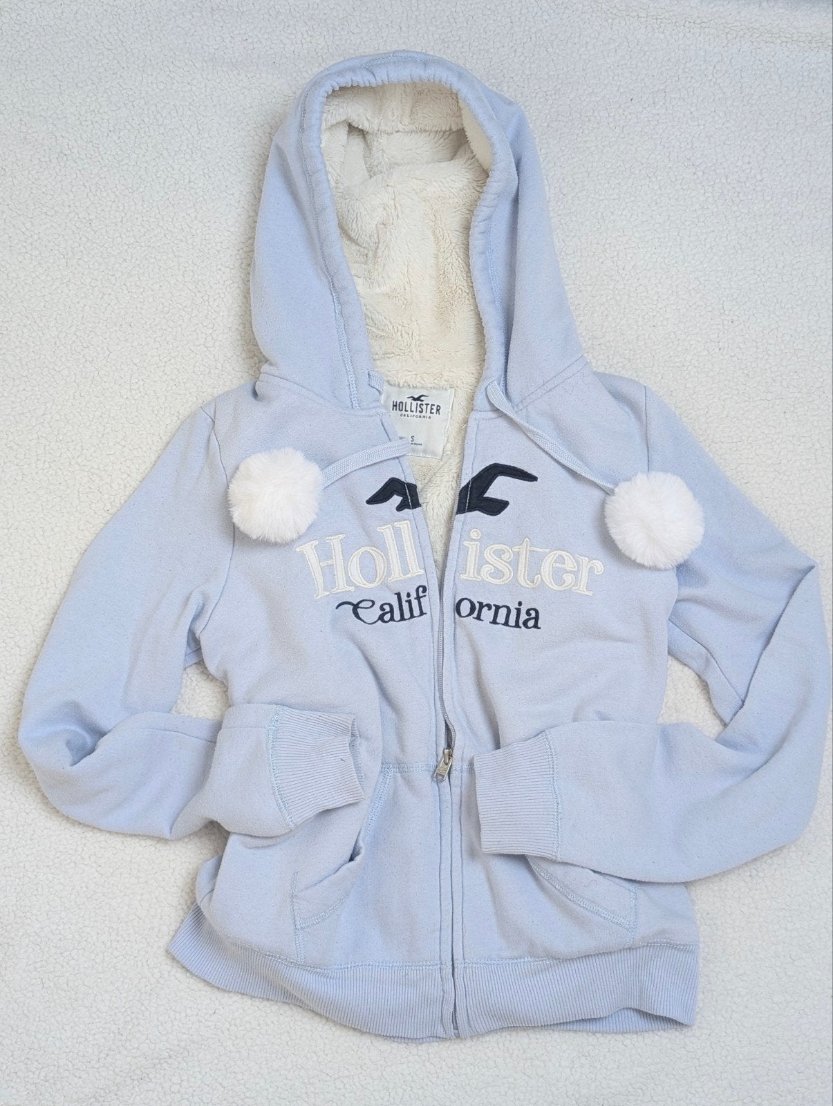 Hollister hoodie baby blue met teddy voering en pompoms, Blauw, Ophalen of Verzenden, Zo goed als nieuw, Maat 36 (S)