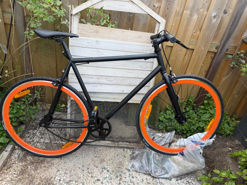 Nieuwe trekfiets met oranje velgen - ongebruikt!, Ophalen