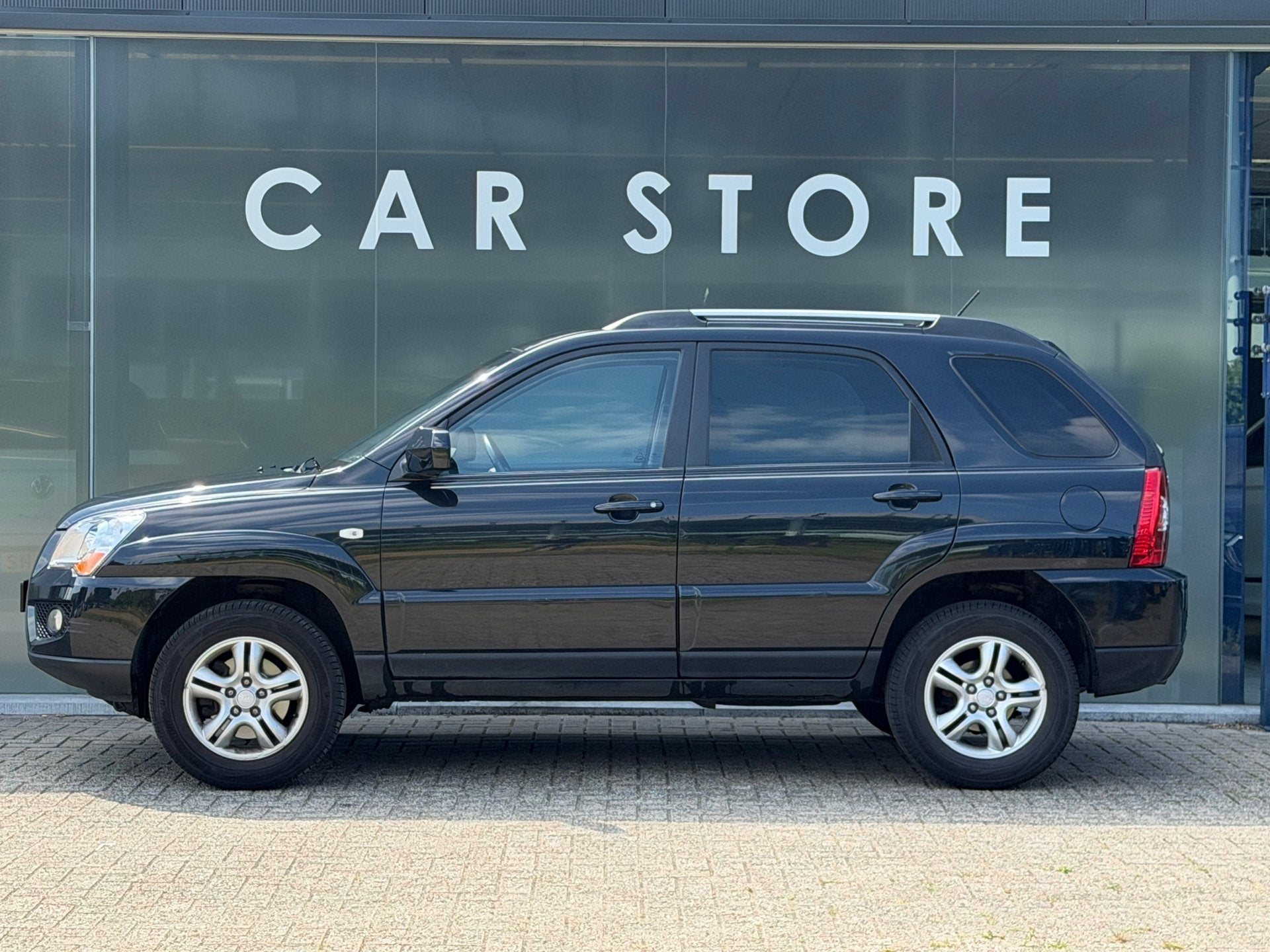 Kia Sportage 2.0 CVVT X-tra, Auto's, Kia, Stof, Gebruikt, Zwart, 4 cilinders