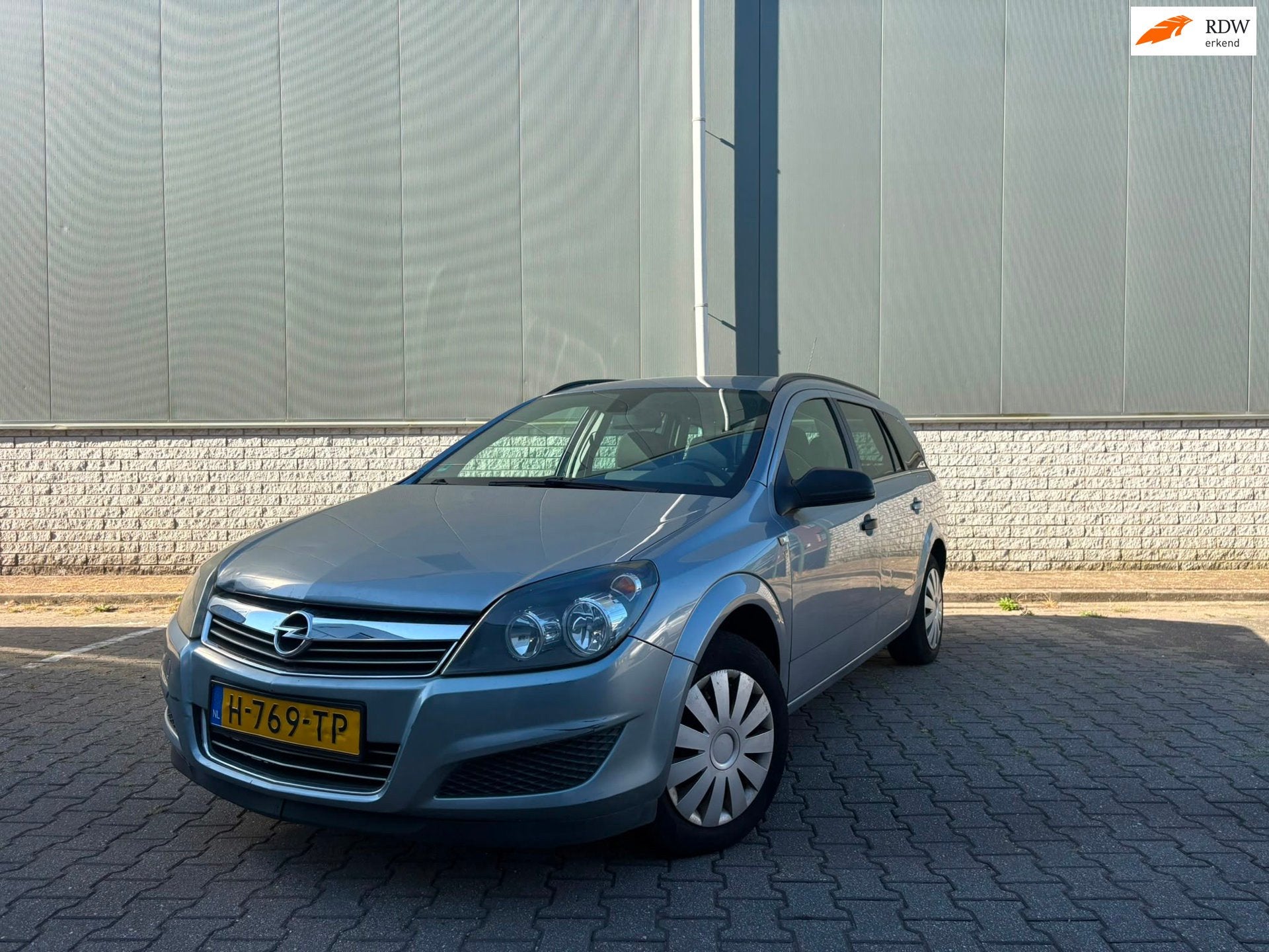 Opel Astra Wagon 1.4 111 years Edition-airco-cruise, Voorwielaandrijving, Gebruikt, 1364 cc, Lichtsensor