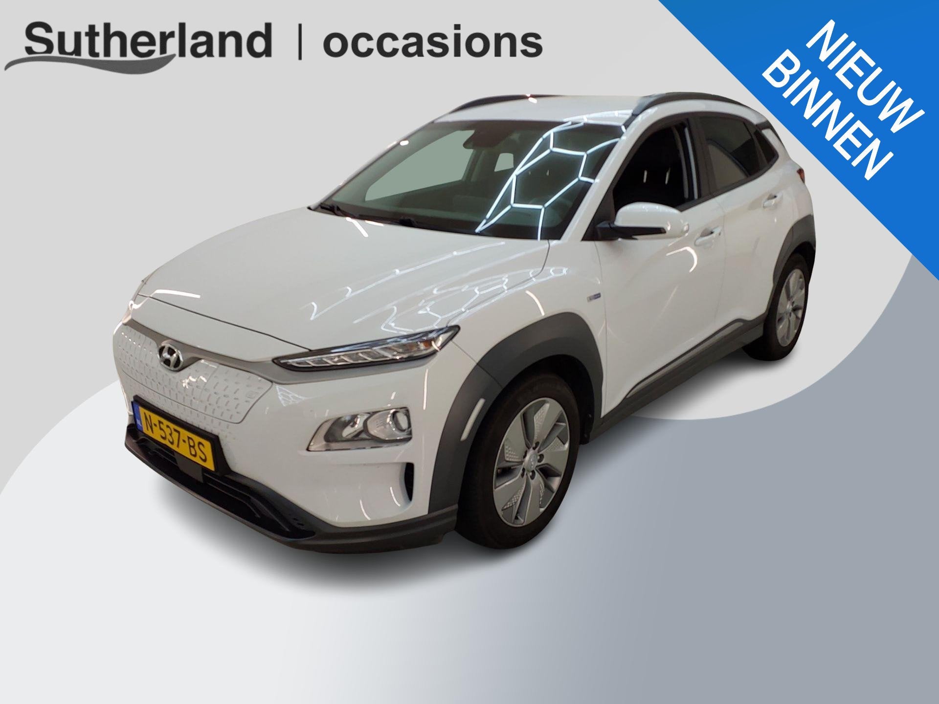 Hyundai Kona EV Fashion 64 kWh | SOH 99,9 % | Warmtepomp | N, Stof, Gebruikt, Verwarmde buitenspiegels, Wit