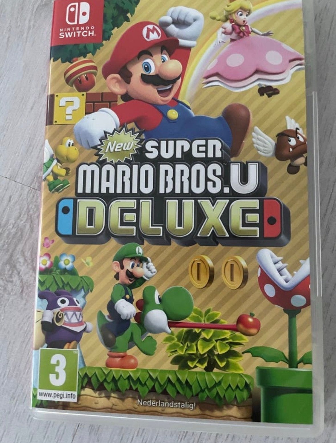 New Super Mario Bros. U Deluxe - Nintendo Switch, Spelcomputers en Games, Ophalen, Eén computer, Zo goed als nieuw, Platform