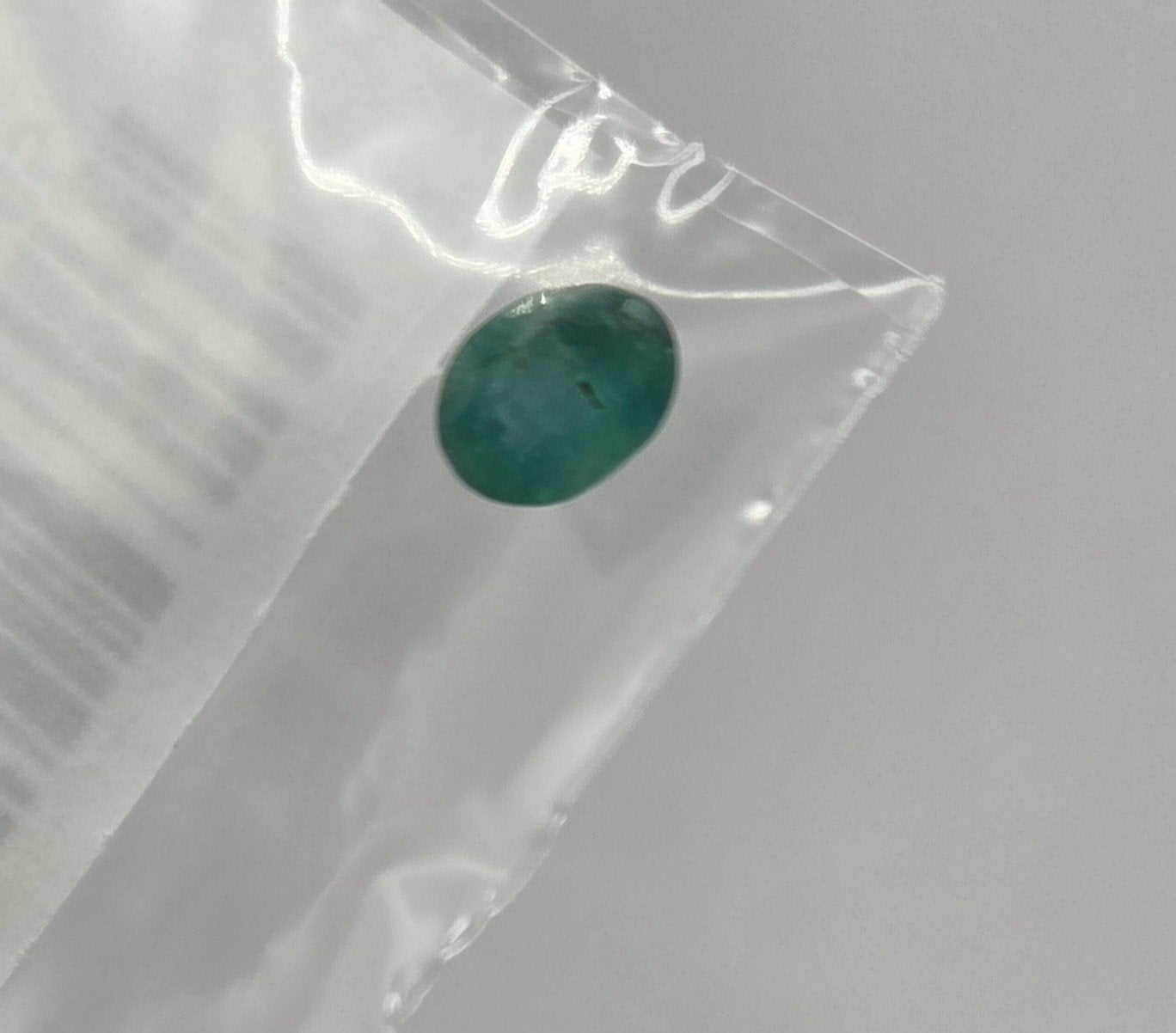 0.90 kt. emerald ovaal facet Zambia, Ophalen of Verzenden, Zo goed als nieuw