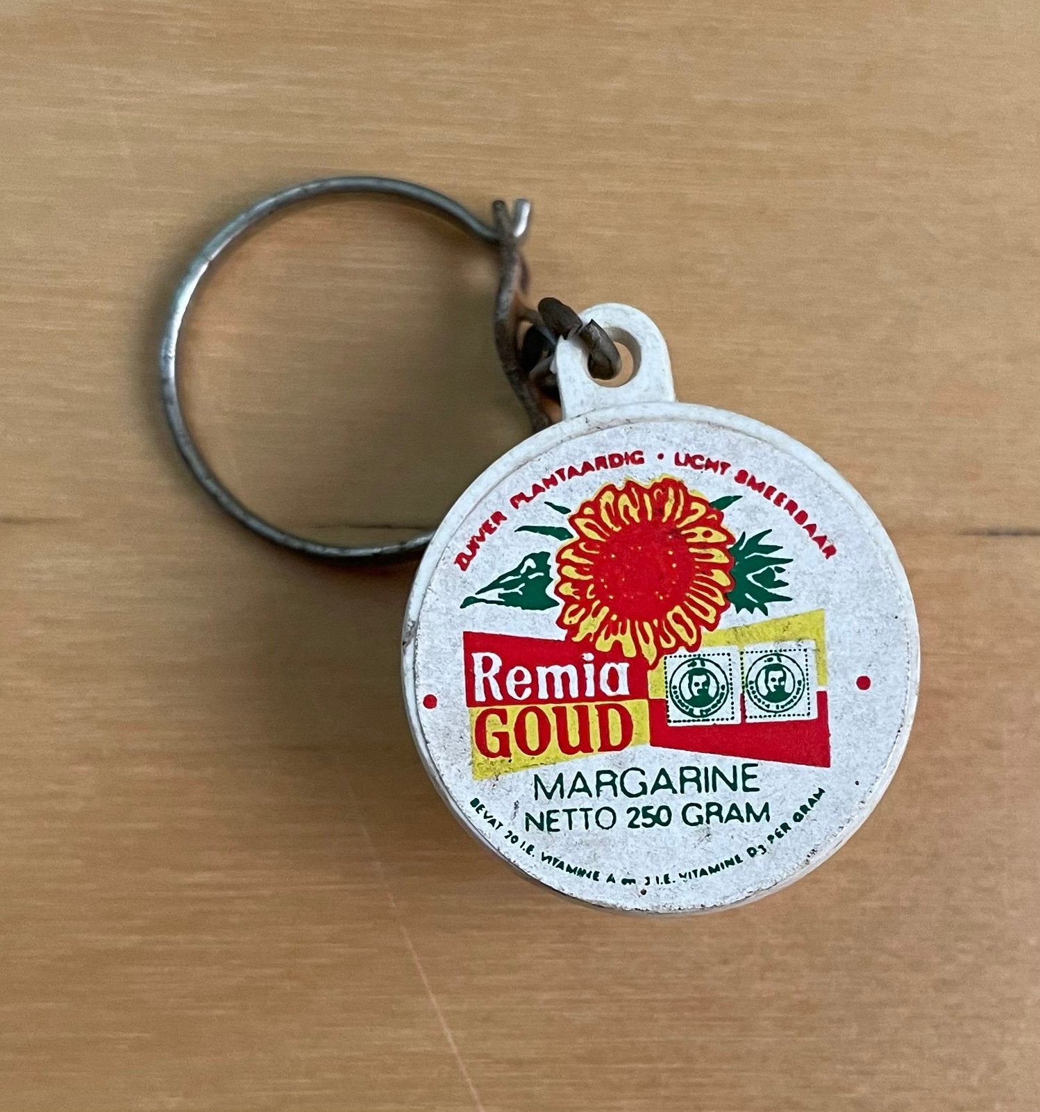 Vintage sleutelhanger Remia goud margarine, Ophalen of Verzenden, Gebruikt, Merk