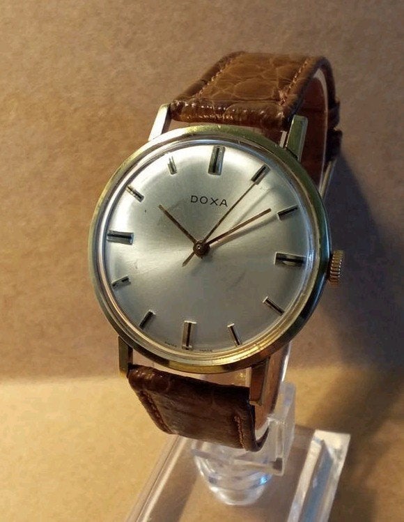 Doxa met nieuwe service, Sieraden, Tassen en Uiterlijk, Horloges | Antiek, Overige merken, Staal, Verguld, 1960 of later
