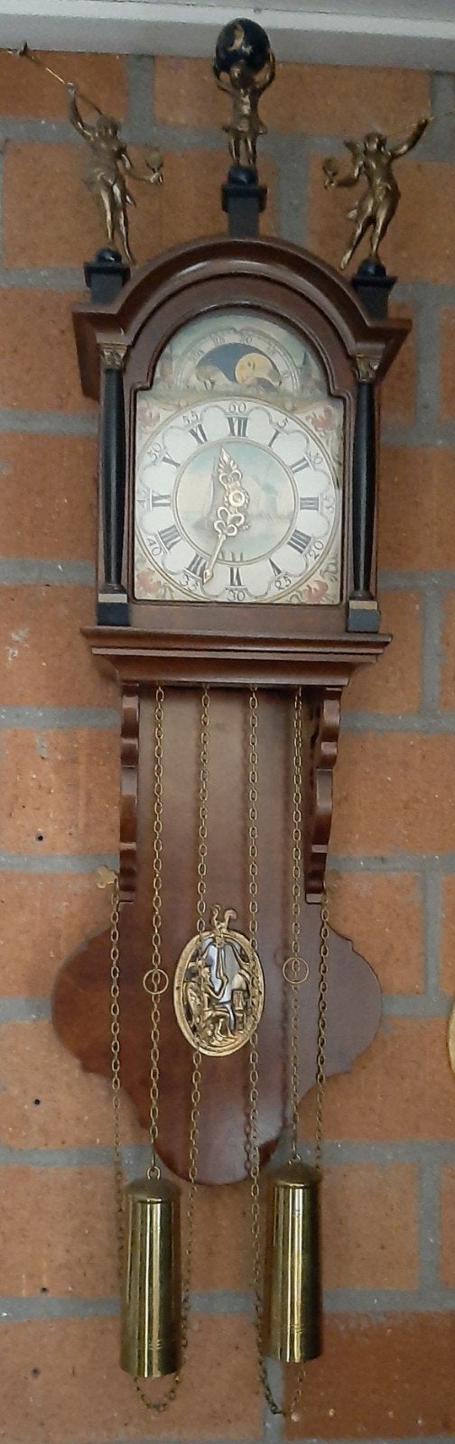 Wandklok met Gewichten en Maanstand, Ophalen