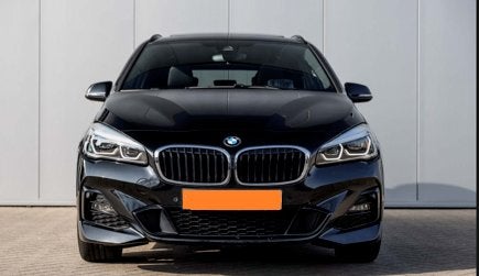 BMW 218i Active Tourer High Executive M Sport Aut. 2019, Auto's, Dealer onderhouden, Parkeerassistent, Zwart, Zwart