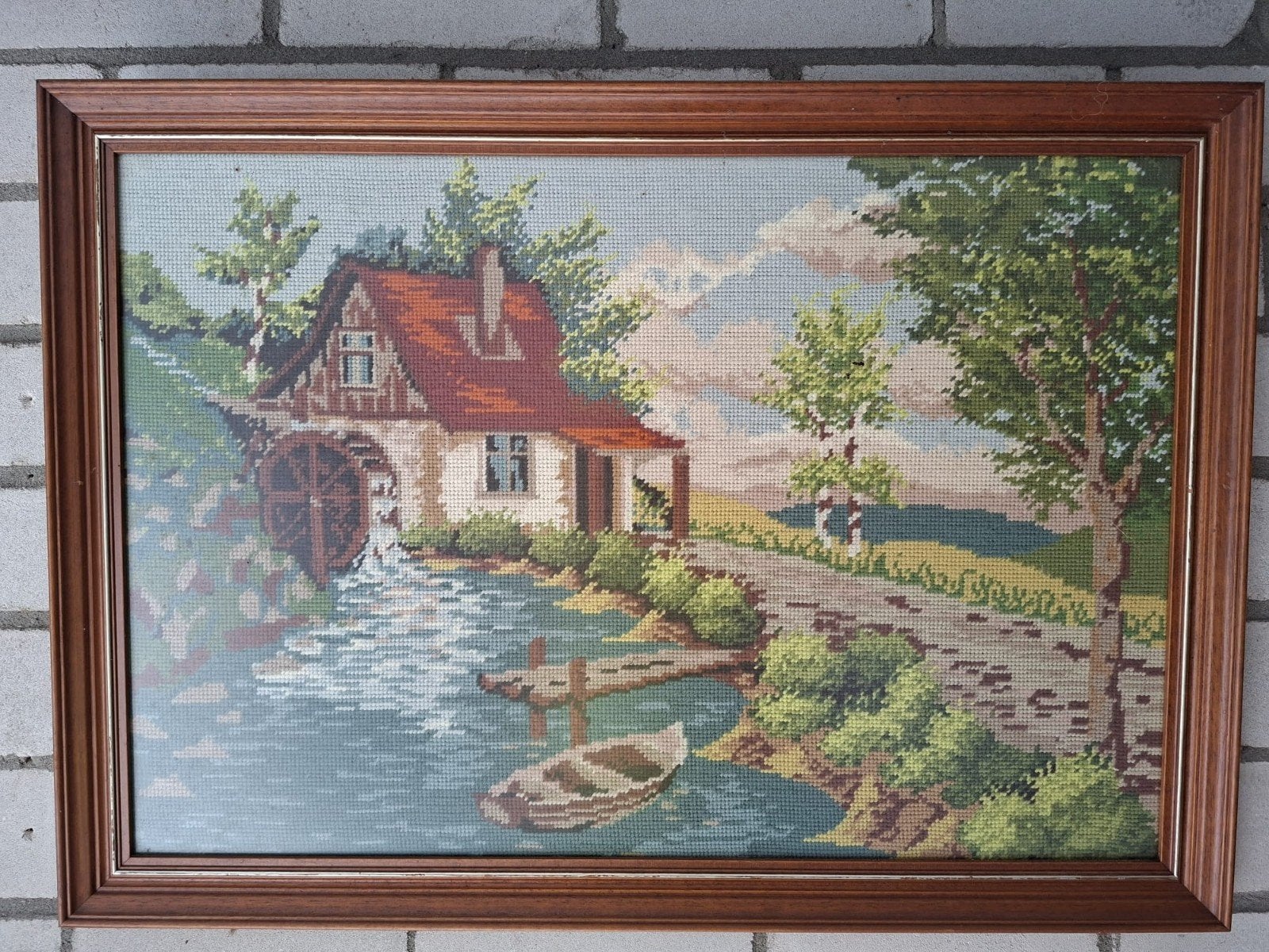 geborduurde schilderijen in lijst, Ophalen