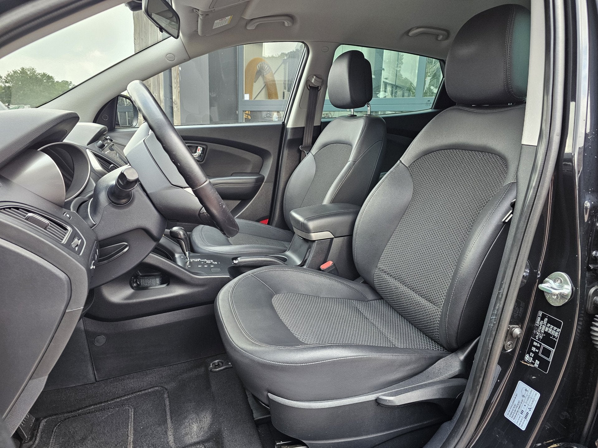 Hyundai ix35 2.0i Style | Automaat | Navi | Trekhaak | Cruis, Gebruikt, Zwart, 4 cilinders, Met garantie (alle)