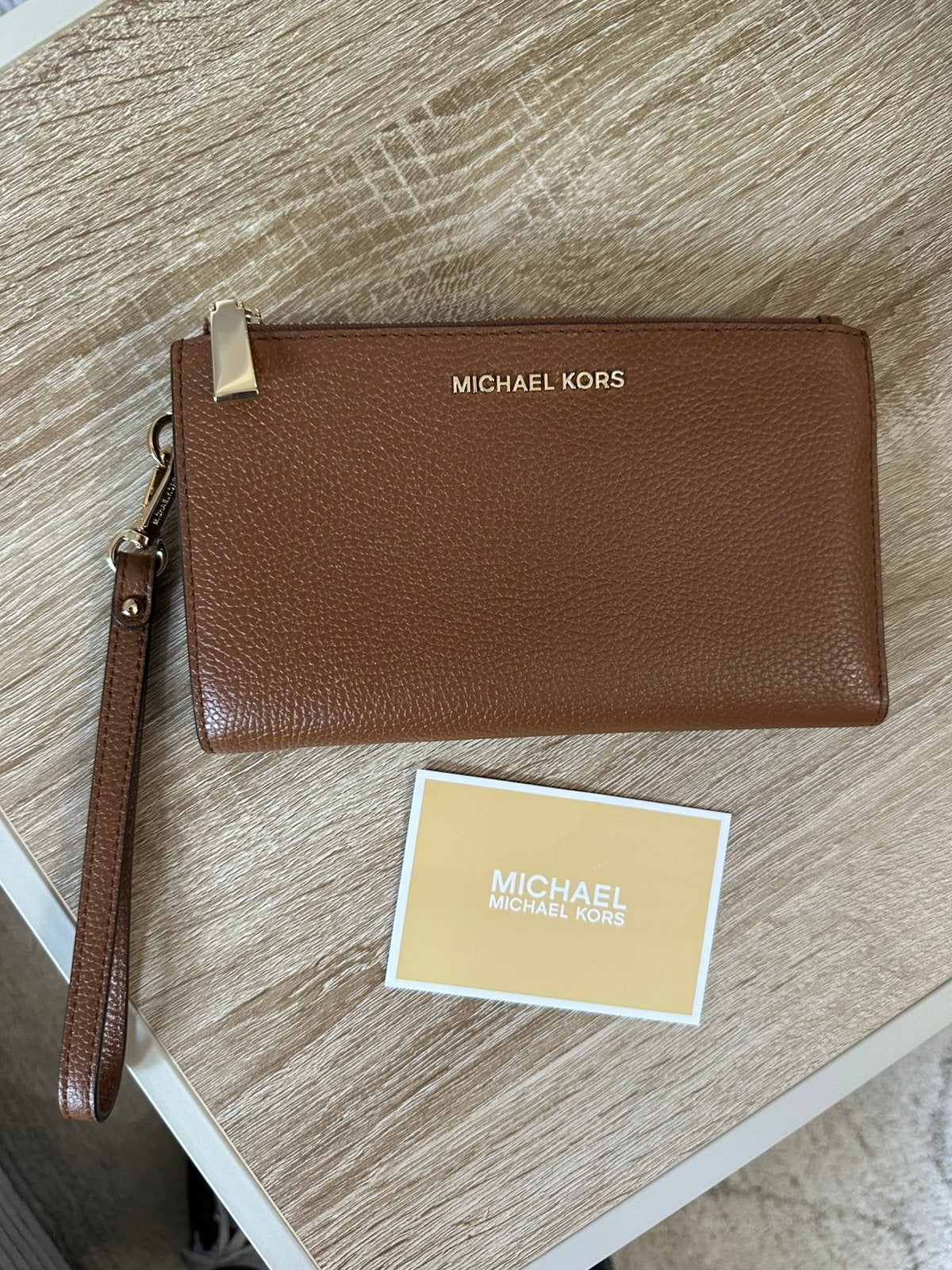Michael Kors Jet Set Wristlet bruin, Ophalen of Verzenden, Zo goed als nieuw, Bruin