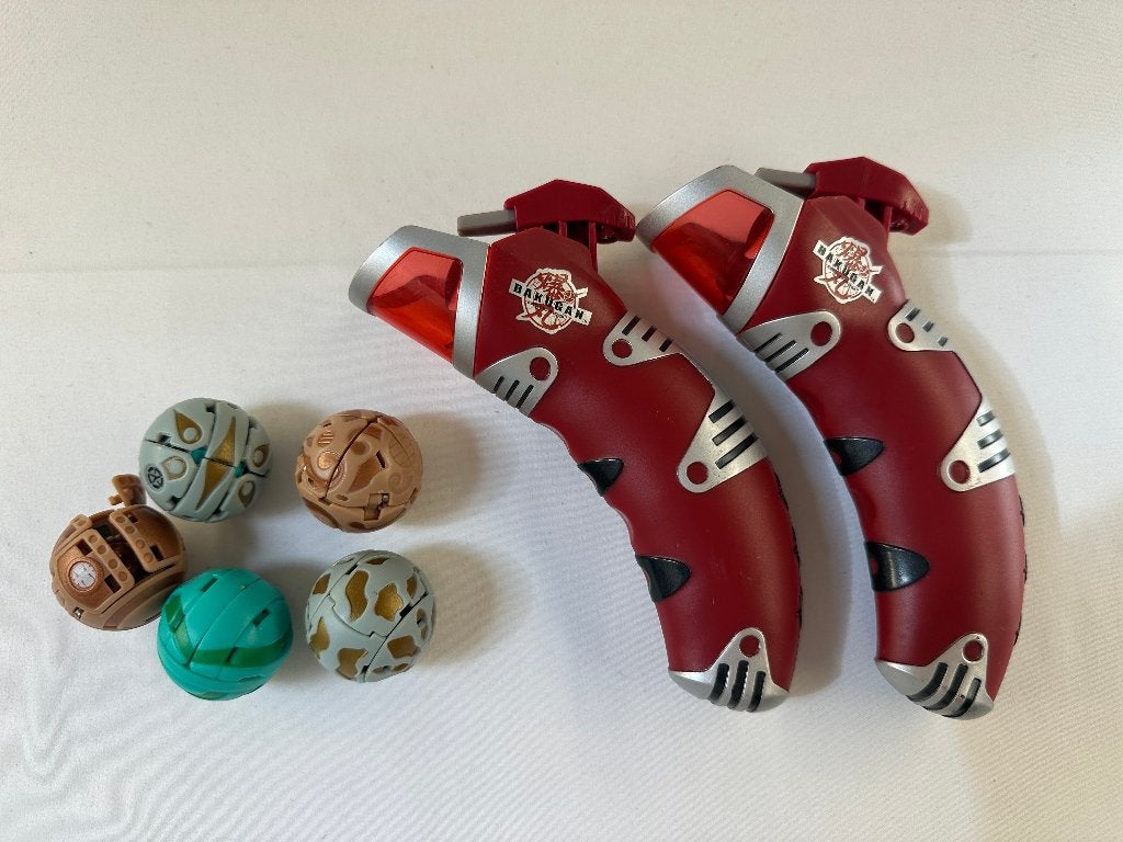 Bakugan Hand Launchers 2 stuks + Ballen - Battle Brawlers, Gebruikt, Onbekend, Ophalen of Verzenden, SEGA