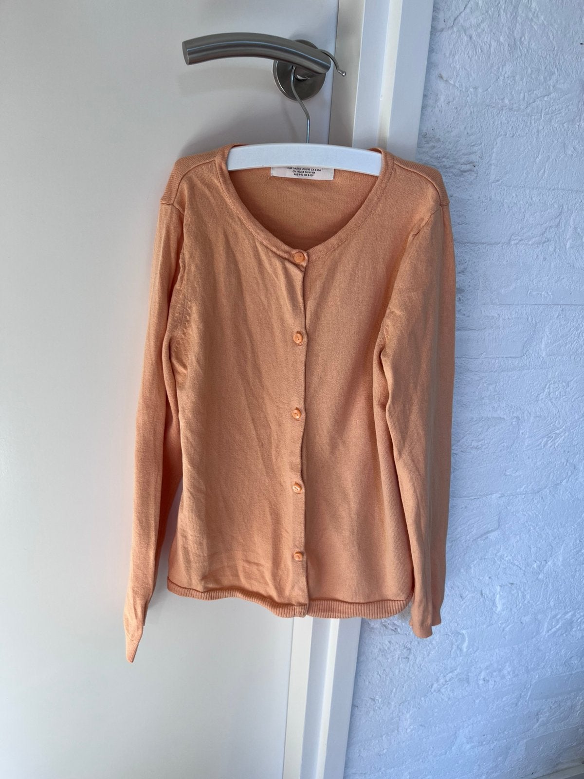 Licht oranje vestje maat 134-140, Kinderen en Baby's, Ophalen of Verzenden, Gebruikt, Meisje, Trui of Vest