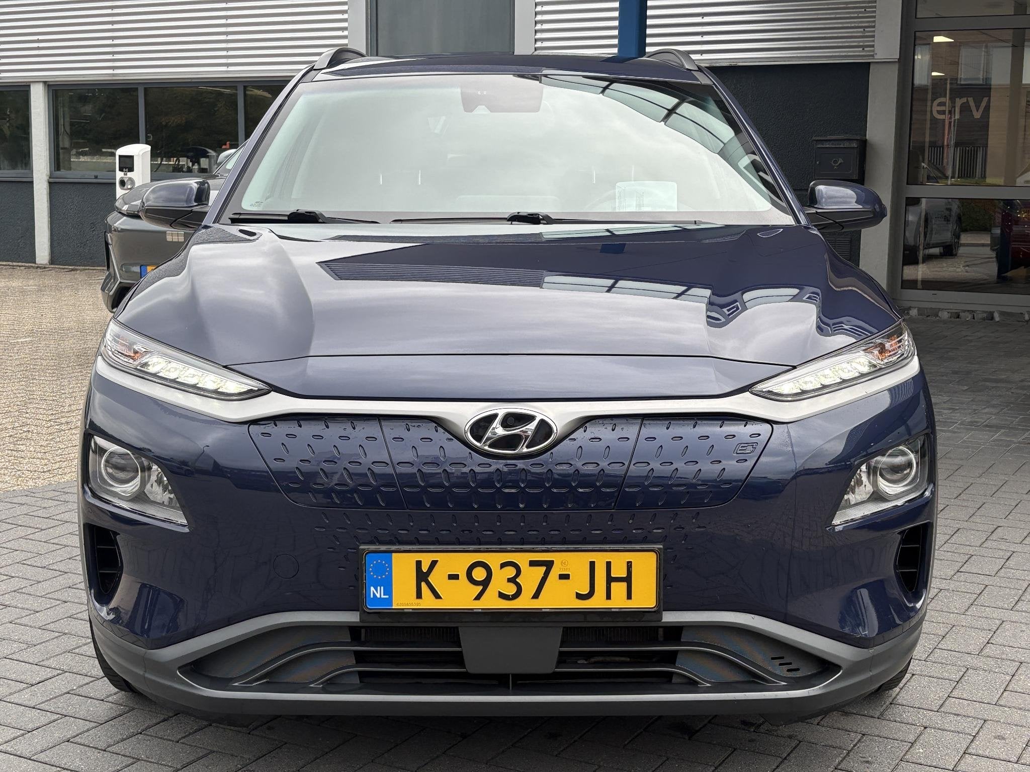 Hyundai Kona EV Fashion 64 kWh | SOH 100% | Head-up Display, Stof, Gebruikt, Blauw, Origineel Nederlands