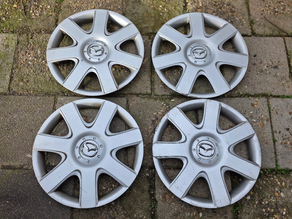 Set van 4 originele wieldoppen Mazda 3 15 inch, Auto diversen, Ophalen of Verzenden, Gebruikt