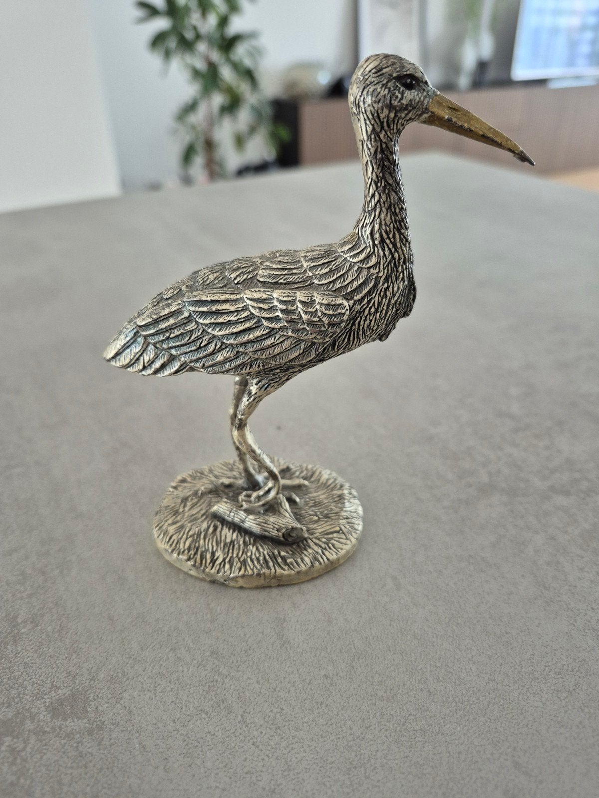 beeldje ooievaar, Ophalen