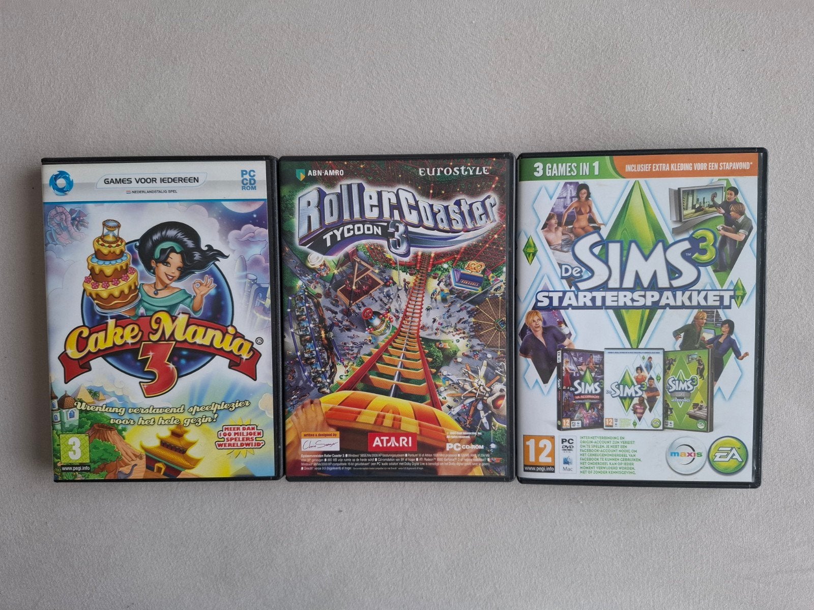 Gratis PC Games: De Sims 3, Rollercoaster Tycoon 3, Cake Man, 1 speler, Ophalen, Gebruikt, Simulatie