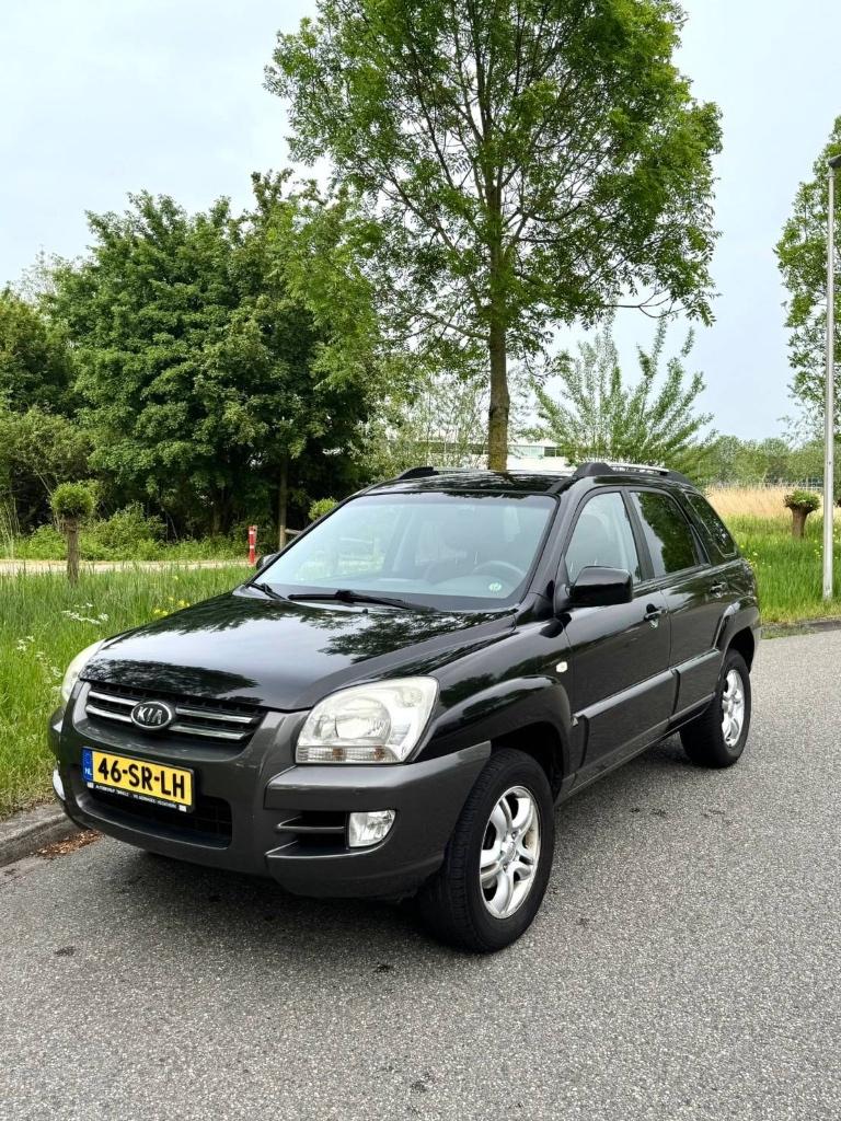 Kia Sportage 2.0 2WD 2006 Zwart, Auto's, Kia, 1442 kg, Stof, Zwart, 4 cilinders