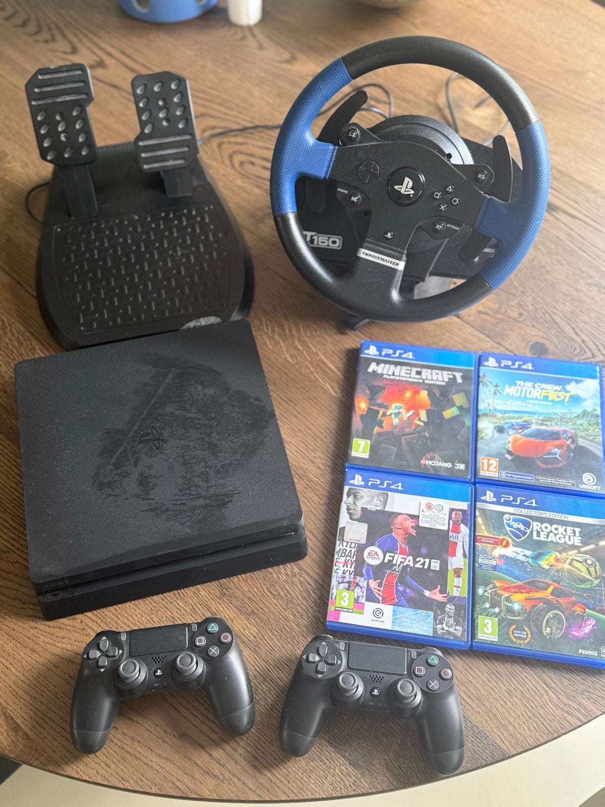 PS4 Slim 500GB met 2 controllers, stuur en 4 games, Met 2 controllers, Ophalen of Verzenden, Slim, 500 GB