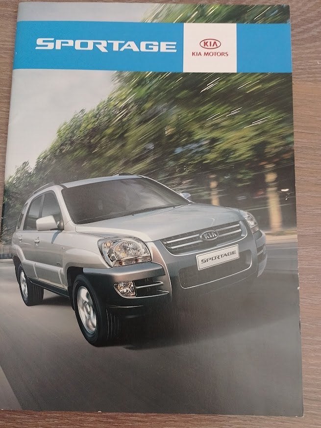 Kia Sportage autofolder, Ophalen of Verzenden, Nieuw, Overige merken