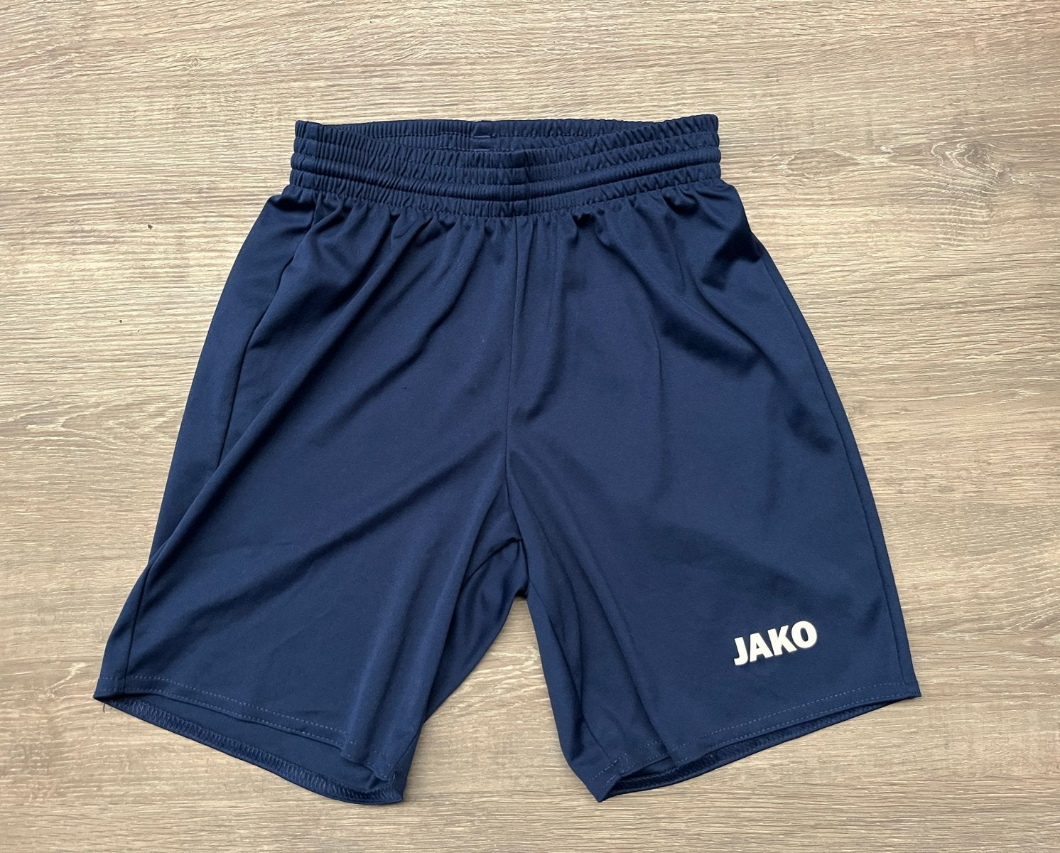 Jako sportbroekje maat 140 - Donkerblauw, Ophalen of Verzenden, Zo goed als nieuw, Jongen of Meisje