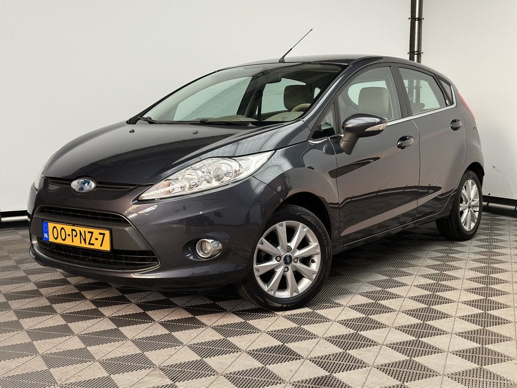 Ford Fiesta 1.25 Ghia 5-drs ECC LM15" NL Auto (bj 2011), Voorwielaandrijving, Euro 5, Stof, Met garantie (alle)