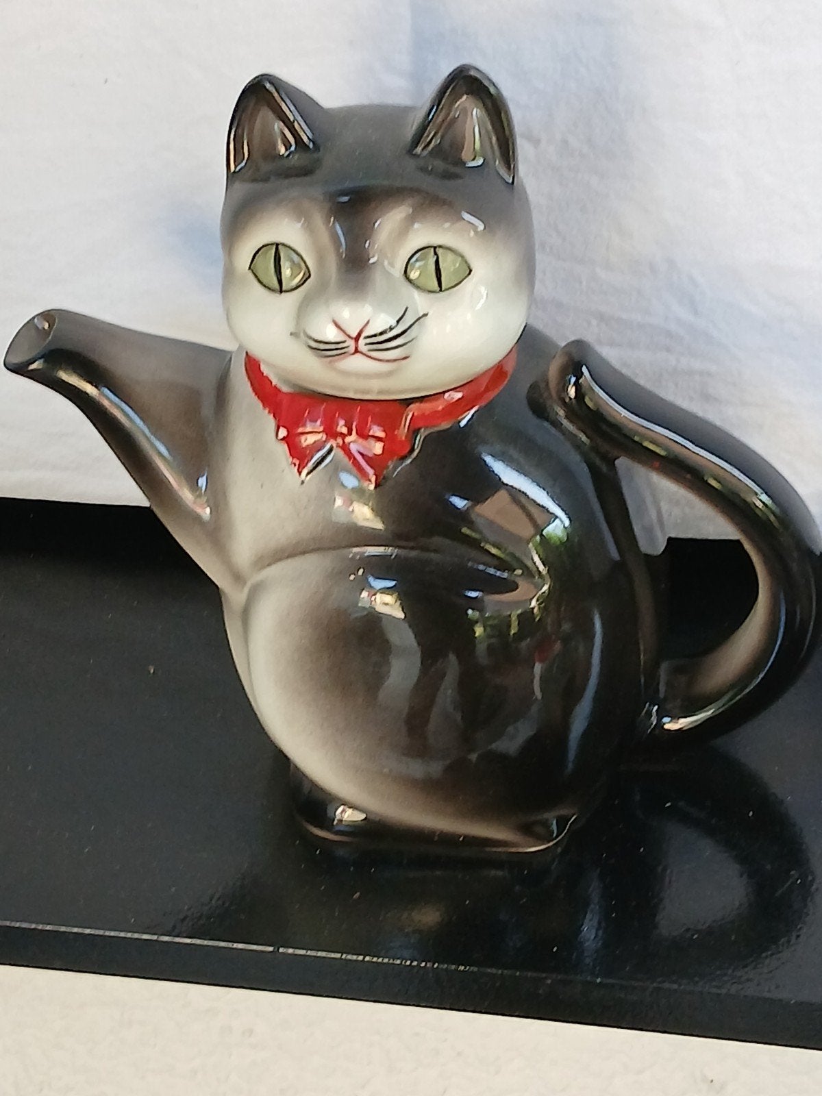 Kat en hond als thee pot, Ophalen