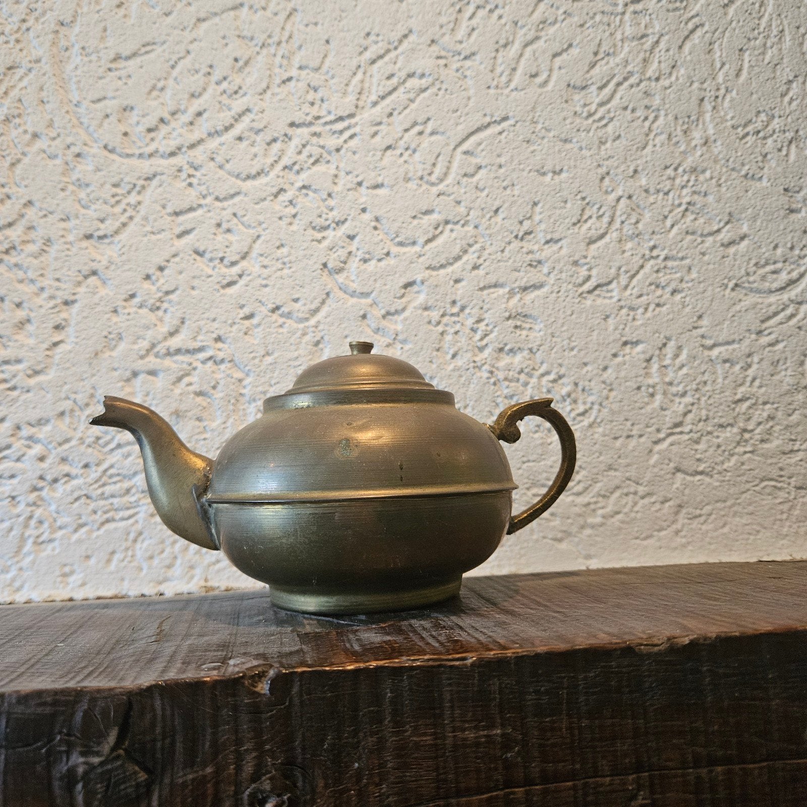 Antieke bronzen theepot, Ophalen