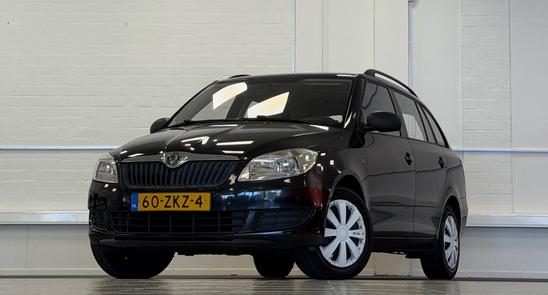 Skoda Fabia Combi 1.2 TSI Arctic Trekhaak Airco 3e Eigenaar, Voorwielaandrijving, Euro 5, Zwart, 4 cilinders