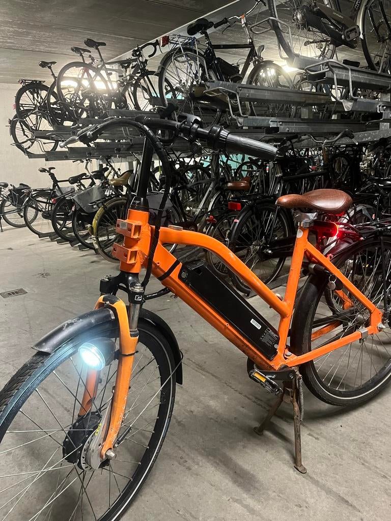 Oranje elektrische fiets - Zo goed als nieuw, Zo goed als nieuw, 51 tot 55 cm, 50 km per accu of meer, Ophalen