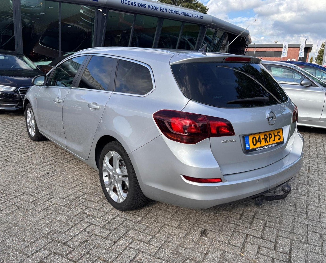 Opel Astra Sports Tourer 1.6 Cosmo, Nwe APK, Navi, Nwe db in, Auto's, Euro 5, Gebruikt, 4 cilinders, 700 kg