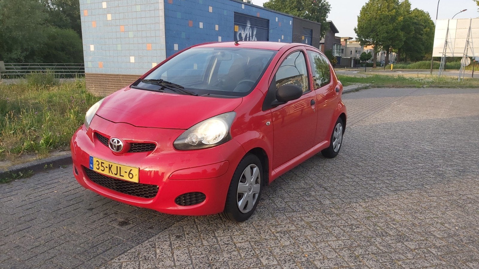 Toyota Aygo 1.0 12V Vvt-i 5DRS 2009 Rood, Auto's, Voorwielaandrijving, 4 stoelen, 68 pk, Handgeschakeld