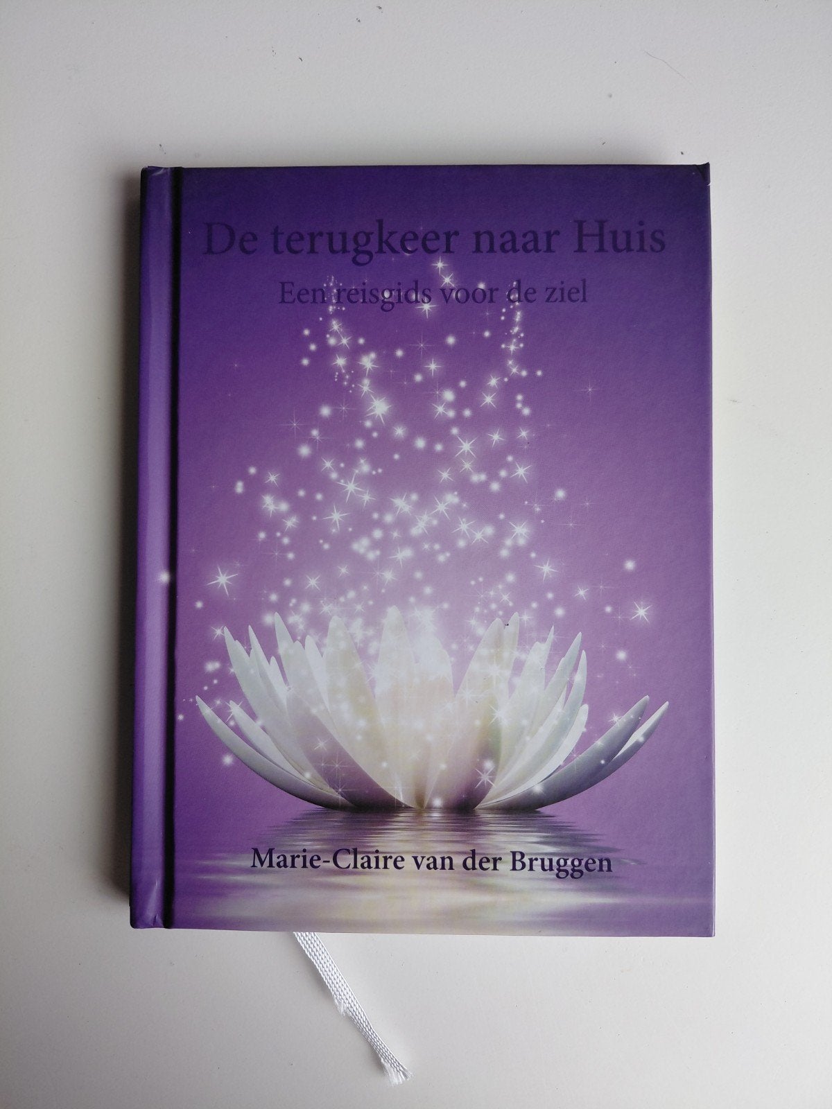 Marie-Claire van der Bruggen - De terugkeer naar Huis, Achtergrond en Informatie, Astrologie, Ophalen of Verzenden, Zo goed als nieuw