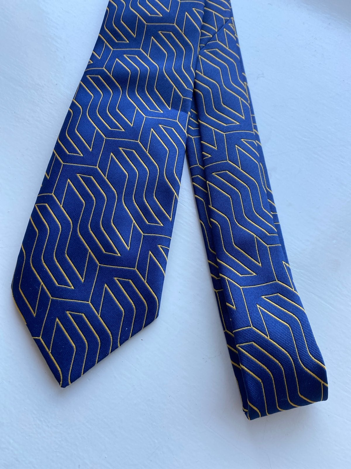 Nette blauwe stropdas met goudkleurig patroon NS, Kleding | Heren, Ophalen of Verzenden, Zo goed als nieuw, Blauw, Met patroon