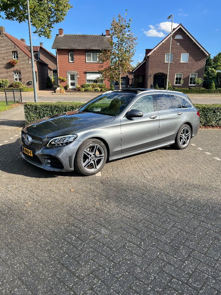 Mercedes-Benz C200 Station AMG | Pano | Winterset | 2018, Automaat, Dealer onderhouden, 1800 kg, Zwart