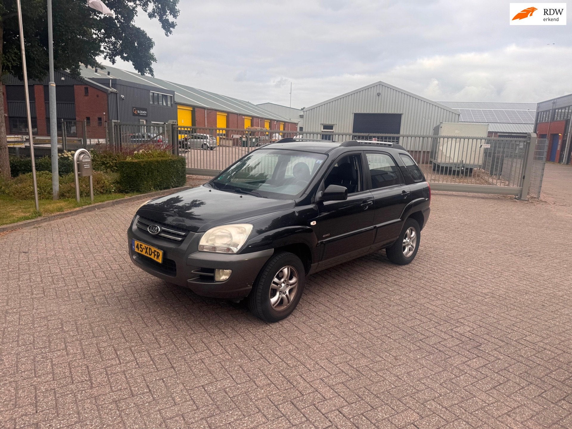 Kia Sportage 2.0 CVVT Adventure 4WD LPG.Clima.Clima, Auto's, Kia, Gebruikt, 4 cilinders, Leder en Stof, Zwart