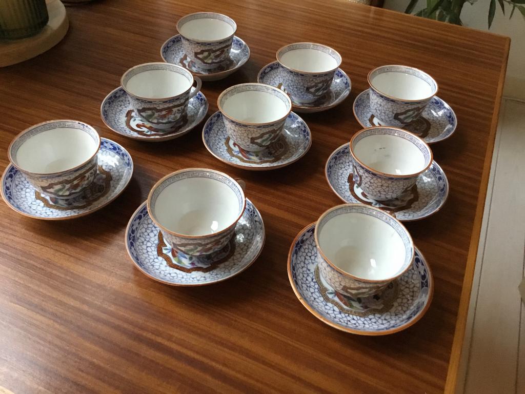 9 Antieke kopjes en schoteltjes. Paradijsvogel.  Rond 1920, Antiek en Kunst, Ophalen of Verzenden