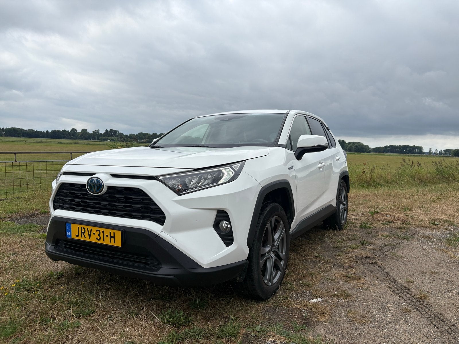 Toyota Rav4 2.5 Hybrid 222pk CVT AWD 2020 Wit, Auto's, Toyota, Automaat, 4 cilinders, 2487 cc, 1650 kg
