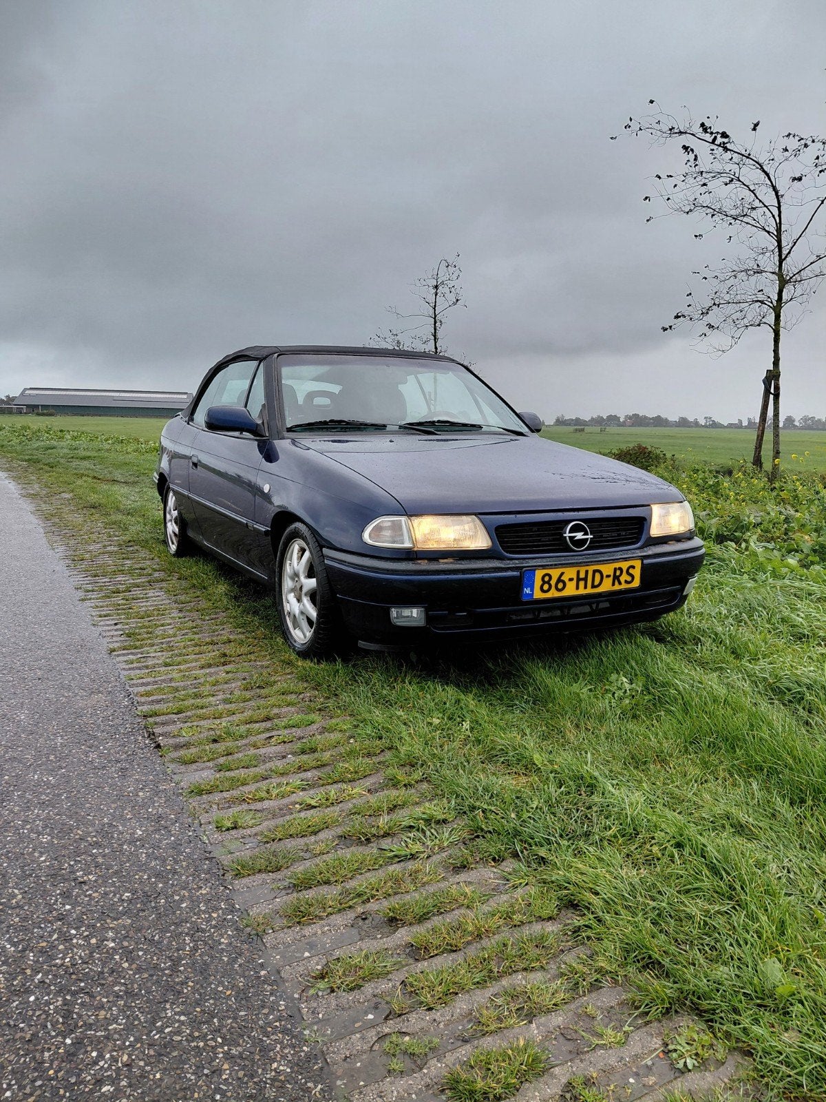 Opel Astra 1.6 Cabrio 1998 Blauw, Auto's, Voorwielaandrijving, 74 pk, 4 cilinders, Cabriolet