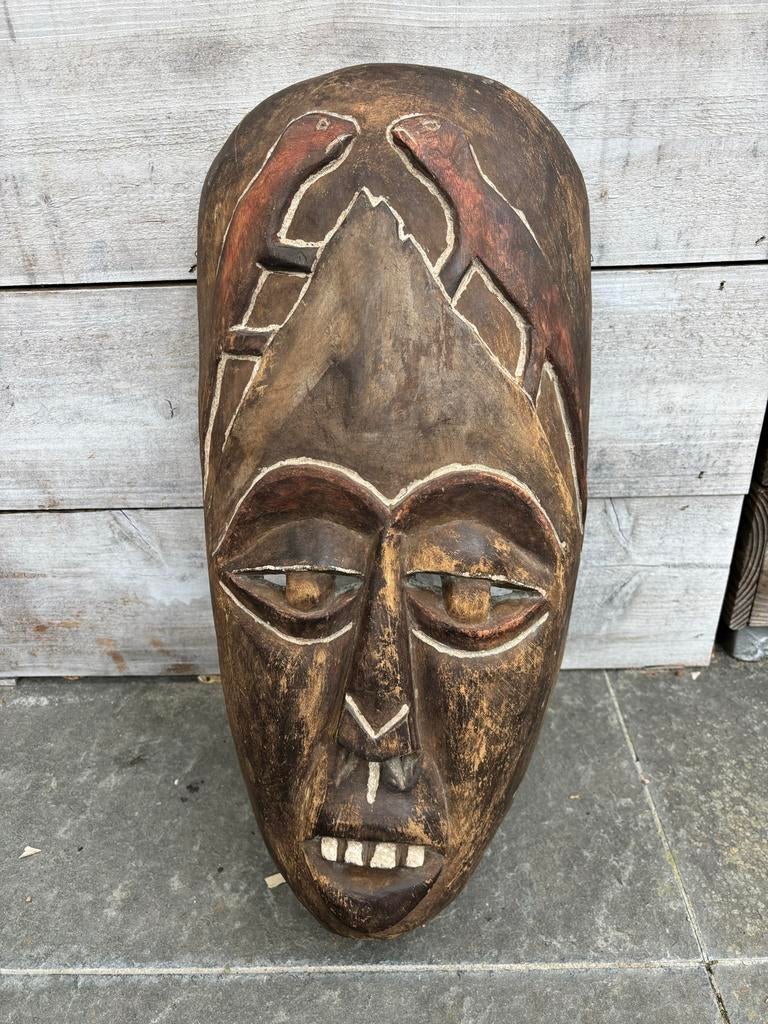 Afrikaans masker, Ophalen